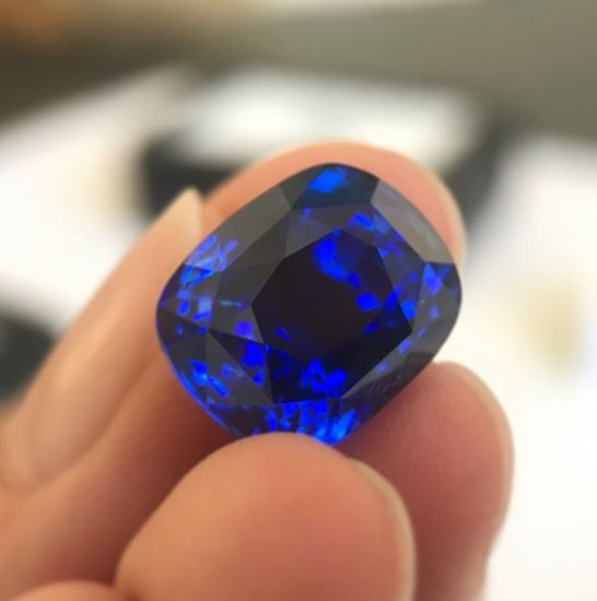 Blue Sapphire 13.49ct Cushion in fingers